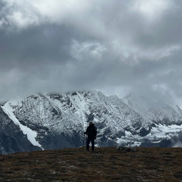Dramatic rocky ridgeline shrouded in clouds near Kyanjin Gompa on the Langtang Valley Trek