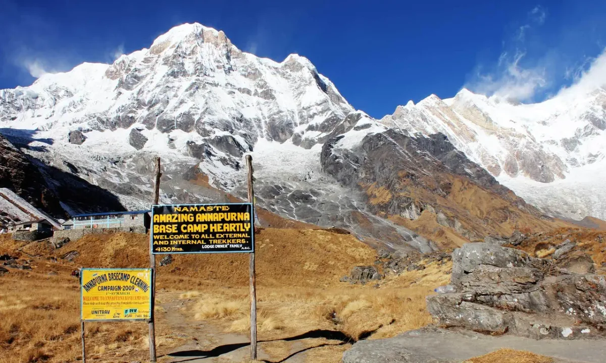 Annapurna Base Camp, Nepal: Snowy peaks, lodges, and welcome signs.