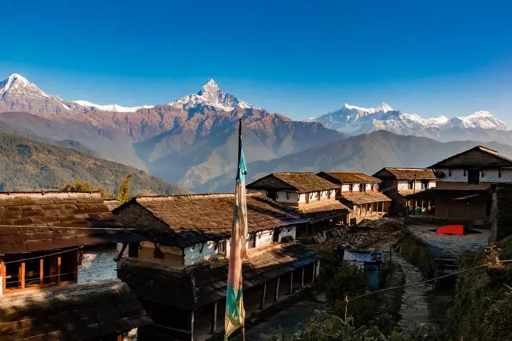 Dhampus village traditional Nepali stone houses with Machapuchare fish tail mountain Annapurna region Nepal trek