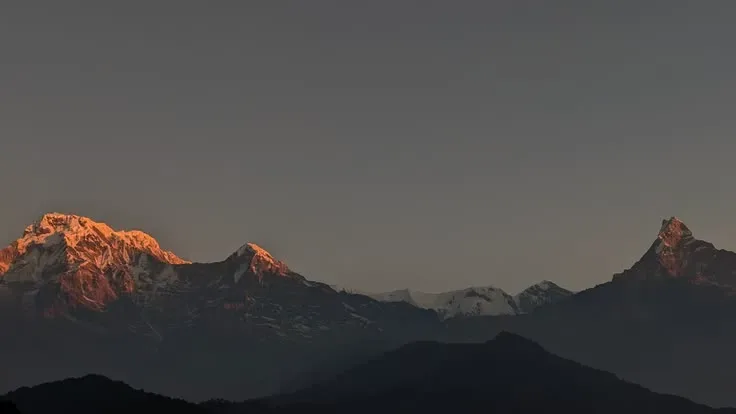 Annapurna mountain range golden hour alpenglow at sunrise Australian Camp trek Nepal