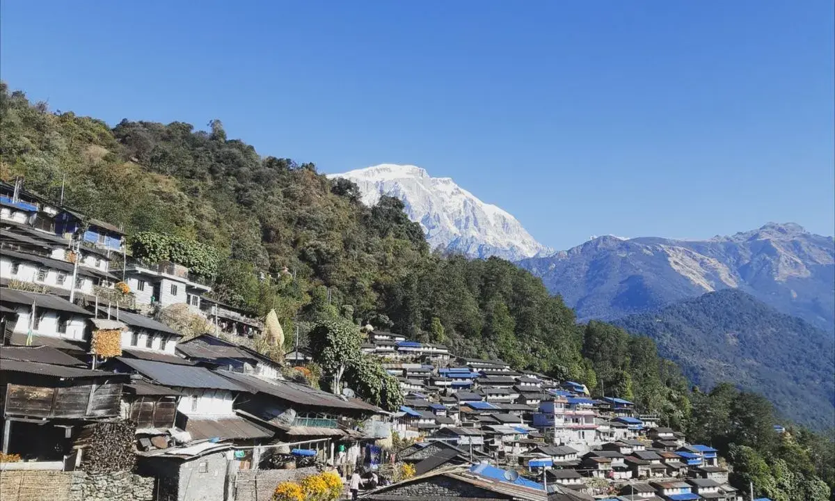 Sikles village traditional stone houses hillside settlement Annapurna foothills Nepal cultural trek