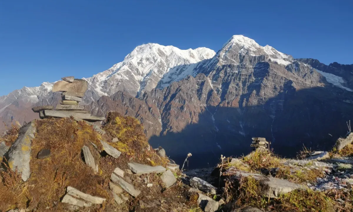 Snow-capped Annapurna range view with teahouse on Mardi Himal Trek Nepal