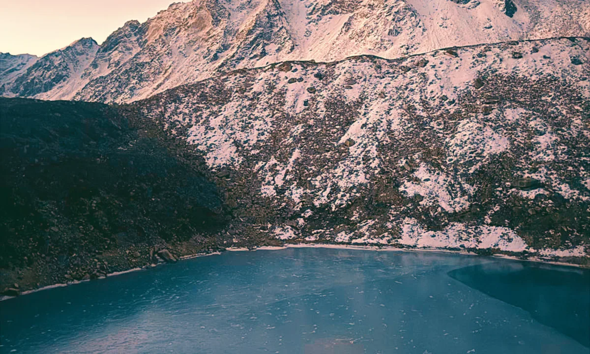 Glacial lake surrounded by rocky Himalayan terrain on the Manaslu Circuit Trek, Nepal