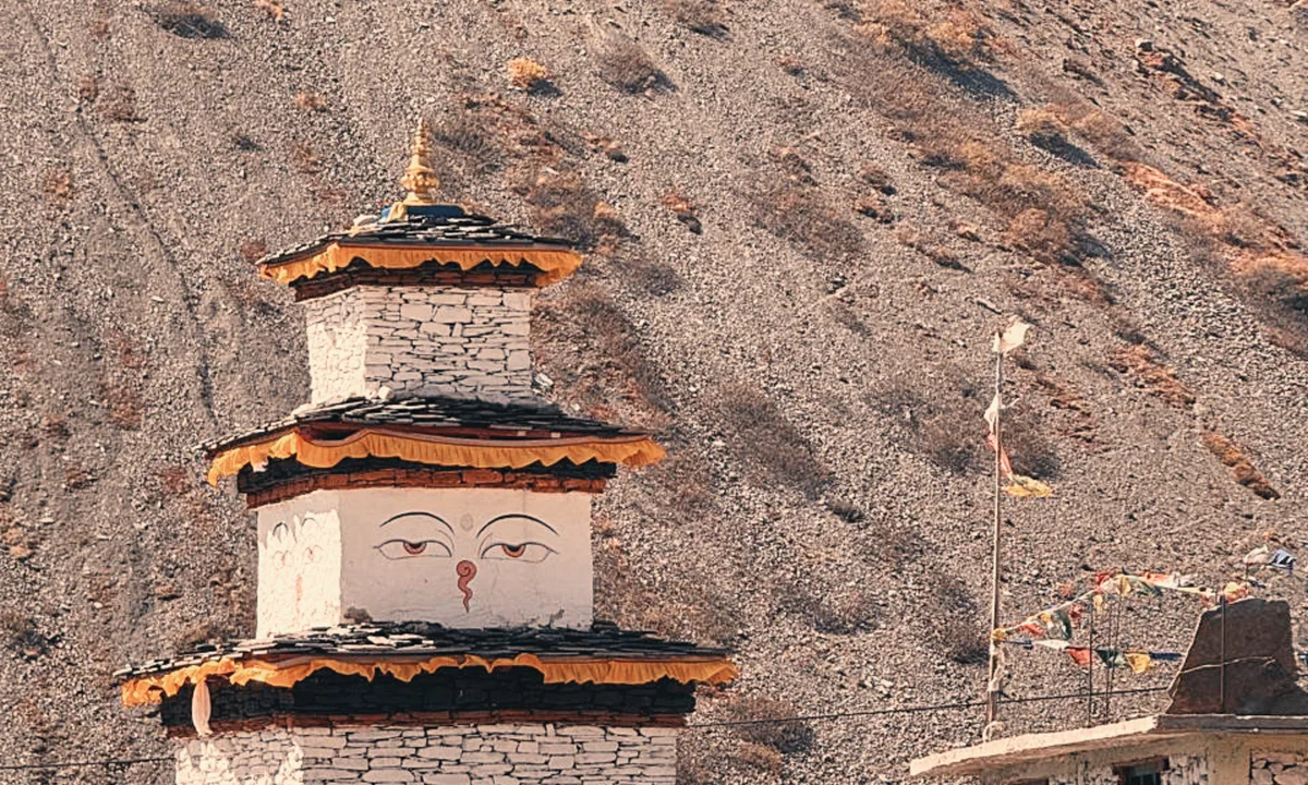 Ancient Buddhist chorten with prayer flags on the Manaslu Circuit Trek trail, Gorkha district