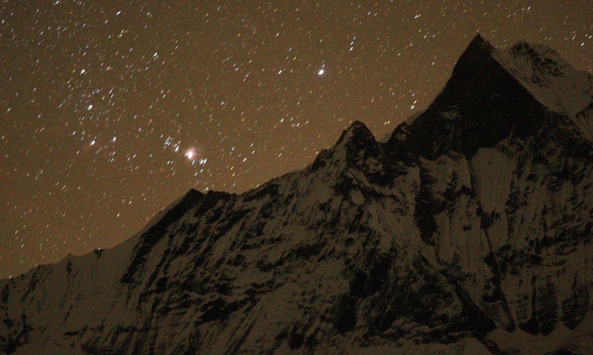 Starry night sky over Machhapuchhre (Fishtail) peak on the Annapurna Base Camp Trek, Nepal