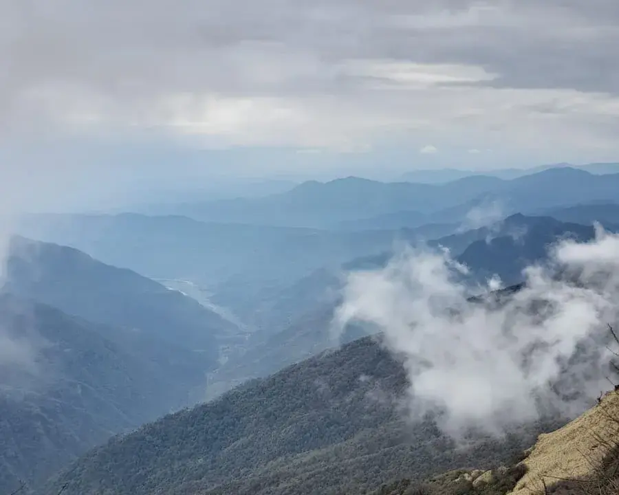 The ridge trail to Mardi Base Camp — clouds in every direction, and fifty meters of visibility at most.
