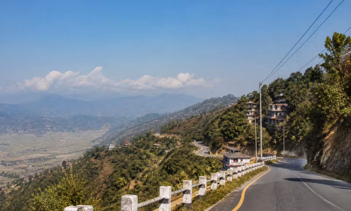 Rolling hills and winding road on the BP Highway past Dhulikhel Nepal on a clear morning