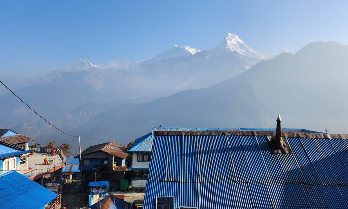Ghorepani village rooftops with Annapurna and Dhaulagiri mountain range, Poon Hill trek, Nepal