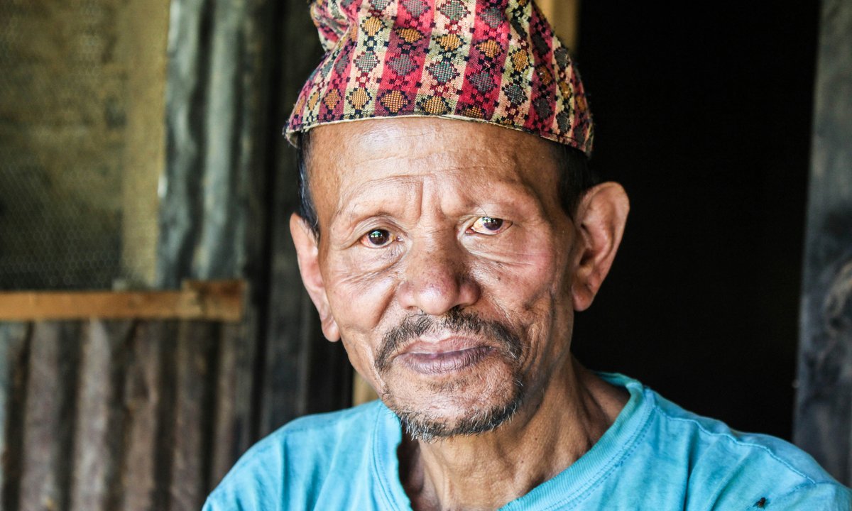 Chhetri man in traditional colourful dhaka topi, representing Nepal's largest ethnic group