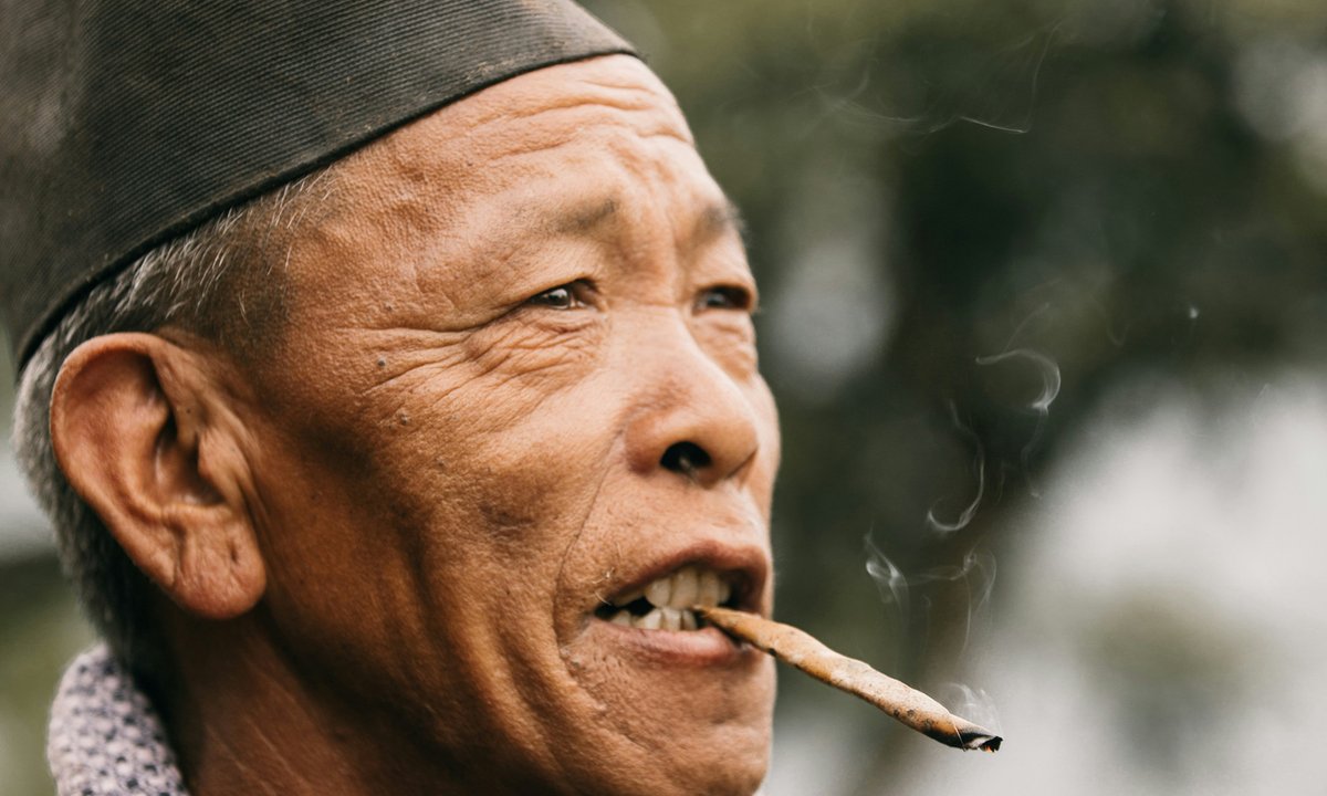 Elder Rai man from the Kirat community of eastern Nepal in a close portrait