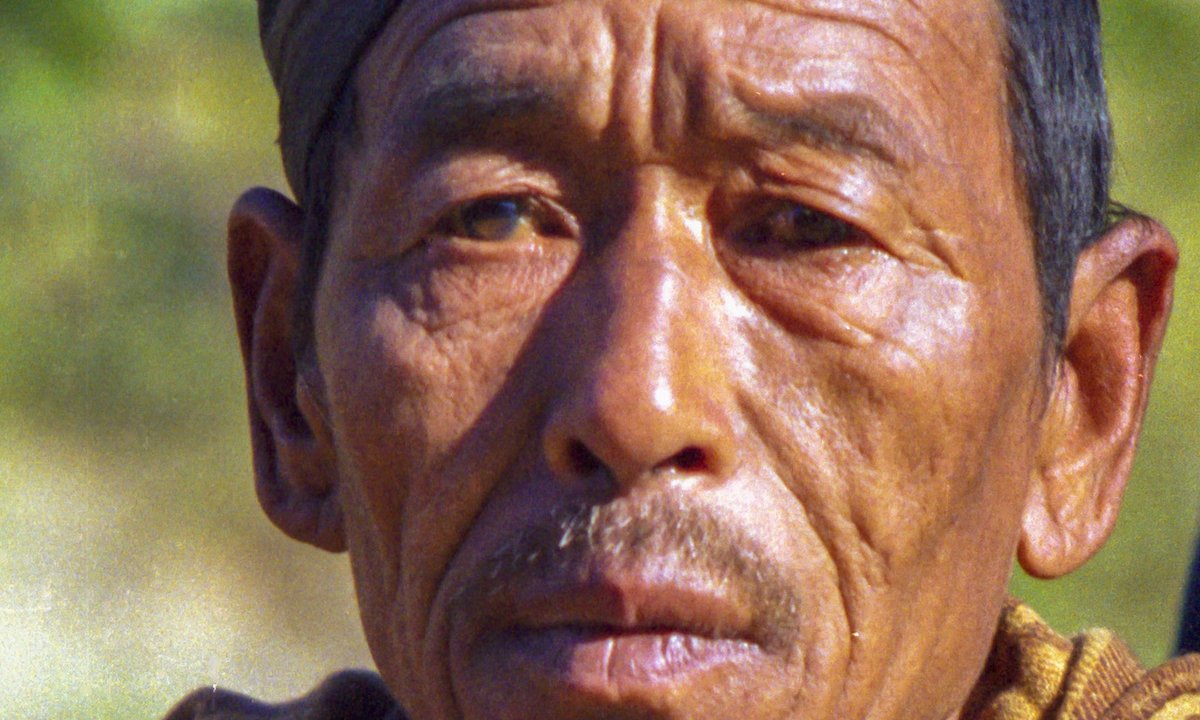 Limbu man in traditional black dhaka topi from the far-eastern hills of Nepal