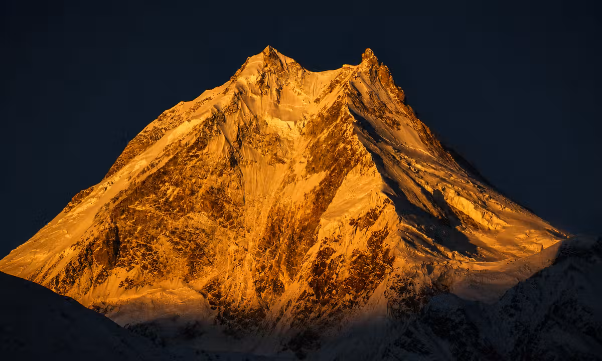 Manaslu summit glowing golden at sunset, eighth highest peak in the world, Nepal Himalayas