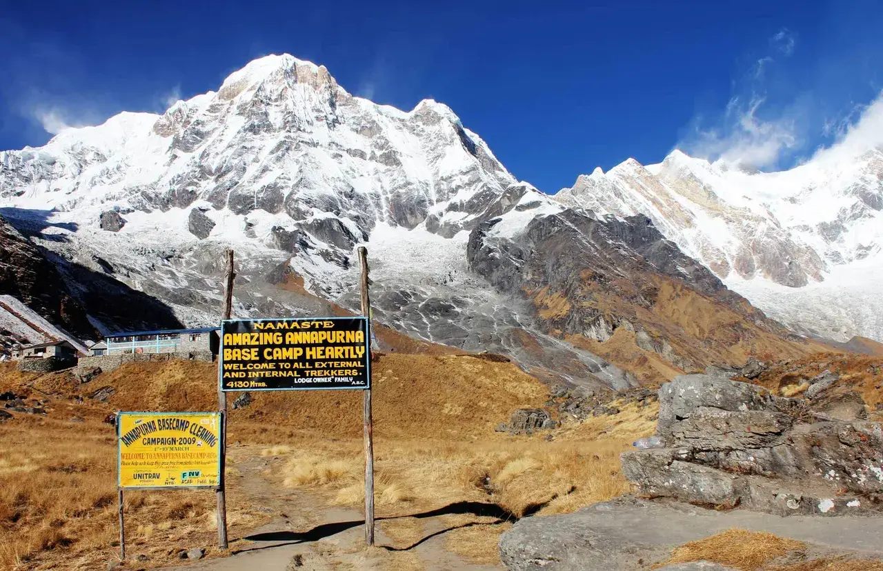 Annapurna Base Camp, Nepal: Snowy peaks, lodges, and welcome signs.