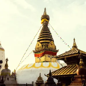 ncient Swayambhunath Stupa with prayer flags in Kathmandu Nepal - UNESCO World Heritage Site Day Tour