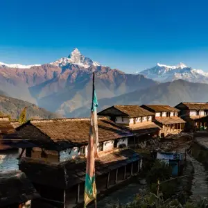 Dhampus village traditional Nepali stone houses with Machapuchare fish tail mountain Annapurna region Nepal trek