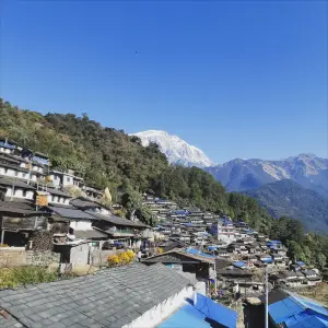 Sikles village traditional stone houses hillside settlement Annapurna foothills Nepal cultural trek