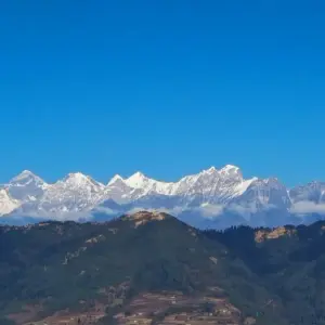 Panoramic view of snow-covered Himalayan mountain range under clear blue sky from Pikey Peak summit, Solukhumbu, Nepal
