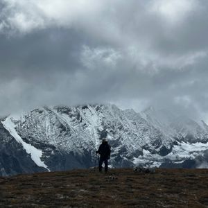 Dramatic rocky ridgeline shrouded in clouds near Kyanjin Gompa on the Langtang Valley Trek
