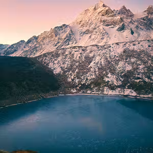 Glacial lake surrounded by rocky Himalayan terrain on the Manaslu Circuit Trek, Nepal