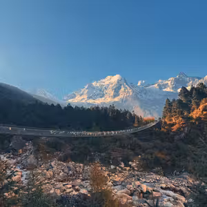 Budhi Gandaki river valley with forested hillsides and Himalayan peaks on the Manaslu Circuit Trek
