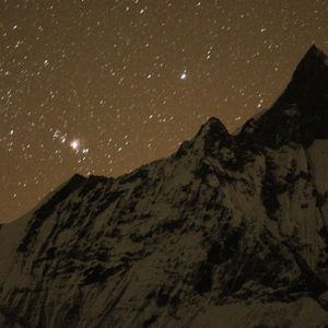 Starry night sky over Machhapuchhre (Fishtail) peak on the Annapurna Base Camp Trek, Nepal