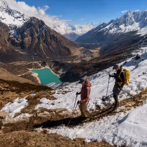 Fastpackers moving fast above glacial lake on Manaslu Circuit high route, Nepal