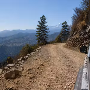 View from a pickup truck on a steep mountain road heading toward Thamdanda in the Solukhumbu foothills, Nepal