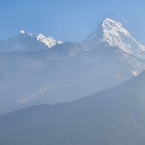 Snow-capped peak of Annapurna South or Hiuchuli from Ulleri on the Ghorepani trek route, Nepal