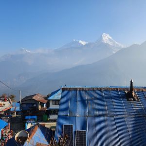Ghorepani village rooftops with Annapurna and Dhaulagiri mountain range, Poon Hill trek, Nepal