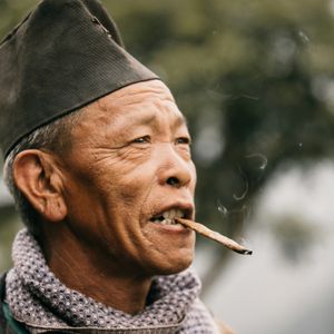 Elder Rai man from the Kirat community of eastern Nepal in a close portrait