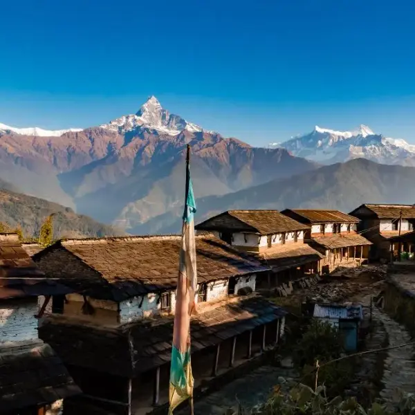 Dhampus village traditional Nepali stone houses with Machapuchare fish tail mountain Annapurna region Nepal trek