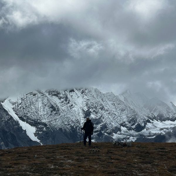 Dramatic rocky ridgeline shrouded in clouds near Kyanjin Gompa on the Langtang Valley Trek