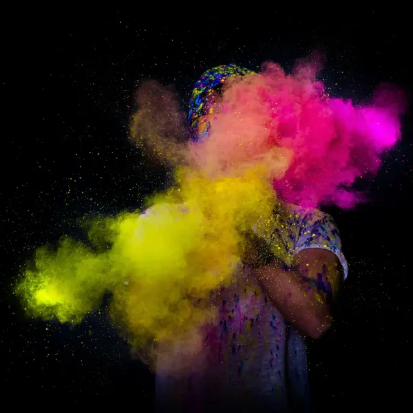 person playing with the colors during holi festival 