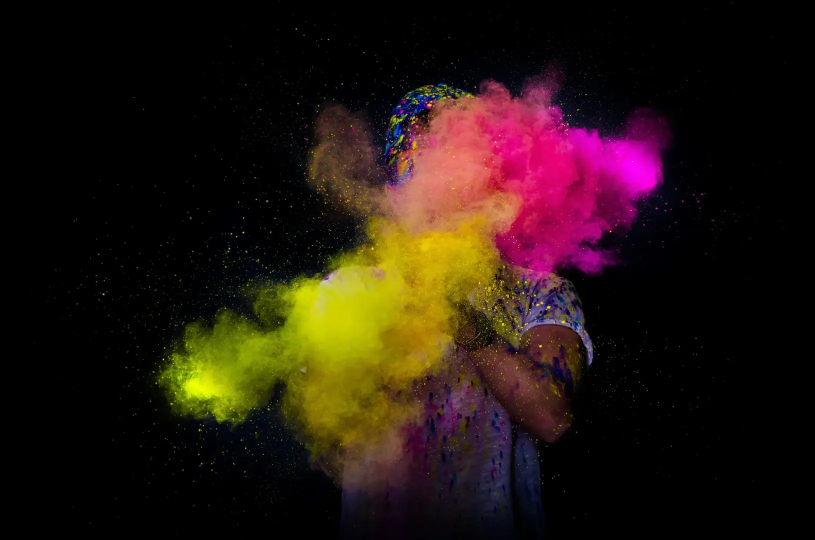 person playing with the colors during holi festival 