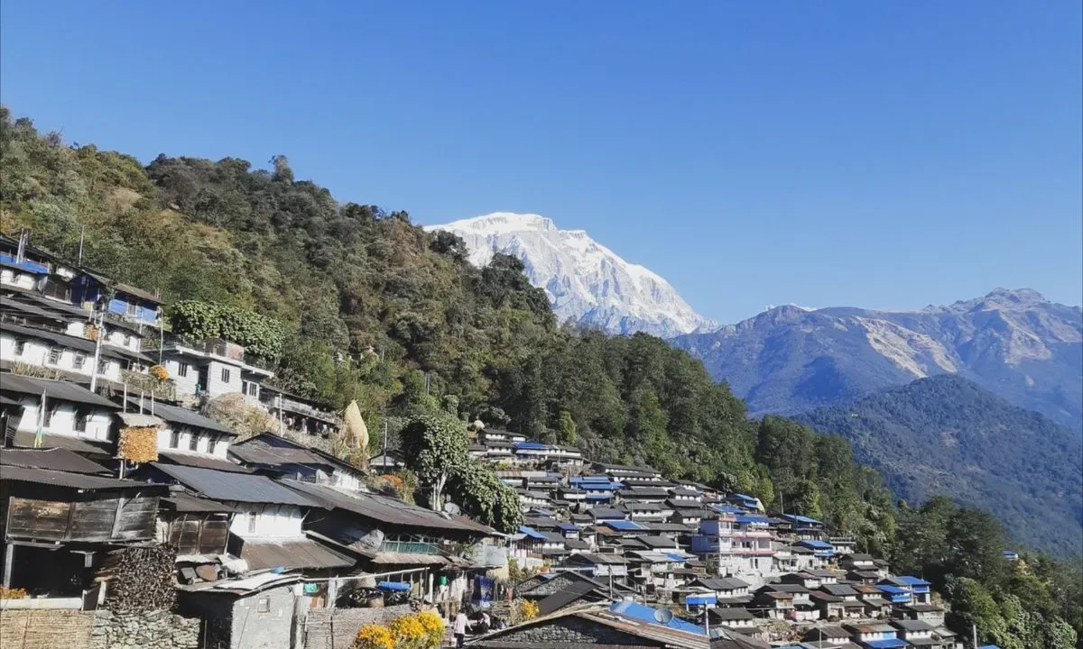 Sikles village traditional stone houses hillside settlement Annapurna foothills Nepal cultural trek